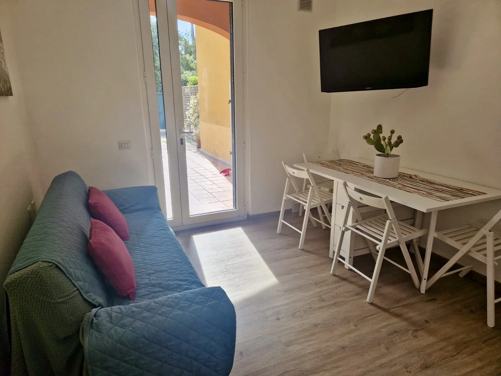 Living area with dining table and TV